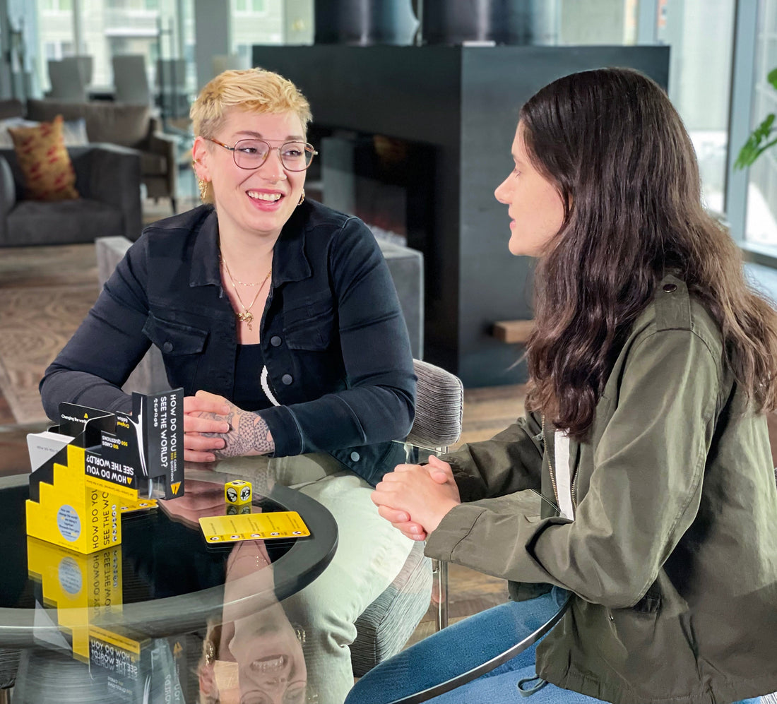 Two women connecting over our Signature card game, How Do You See the World. Authentic Agility Games