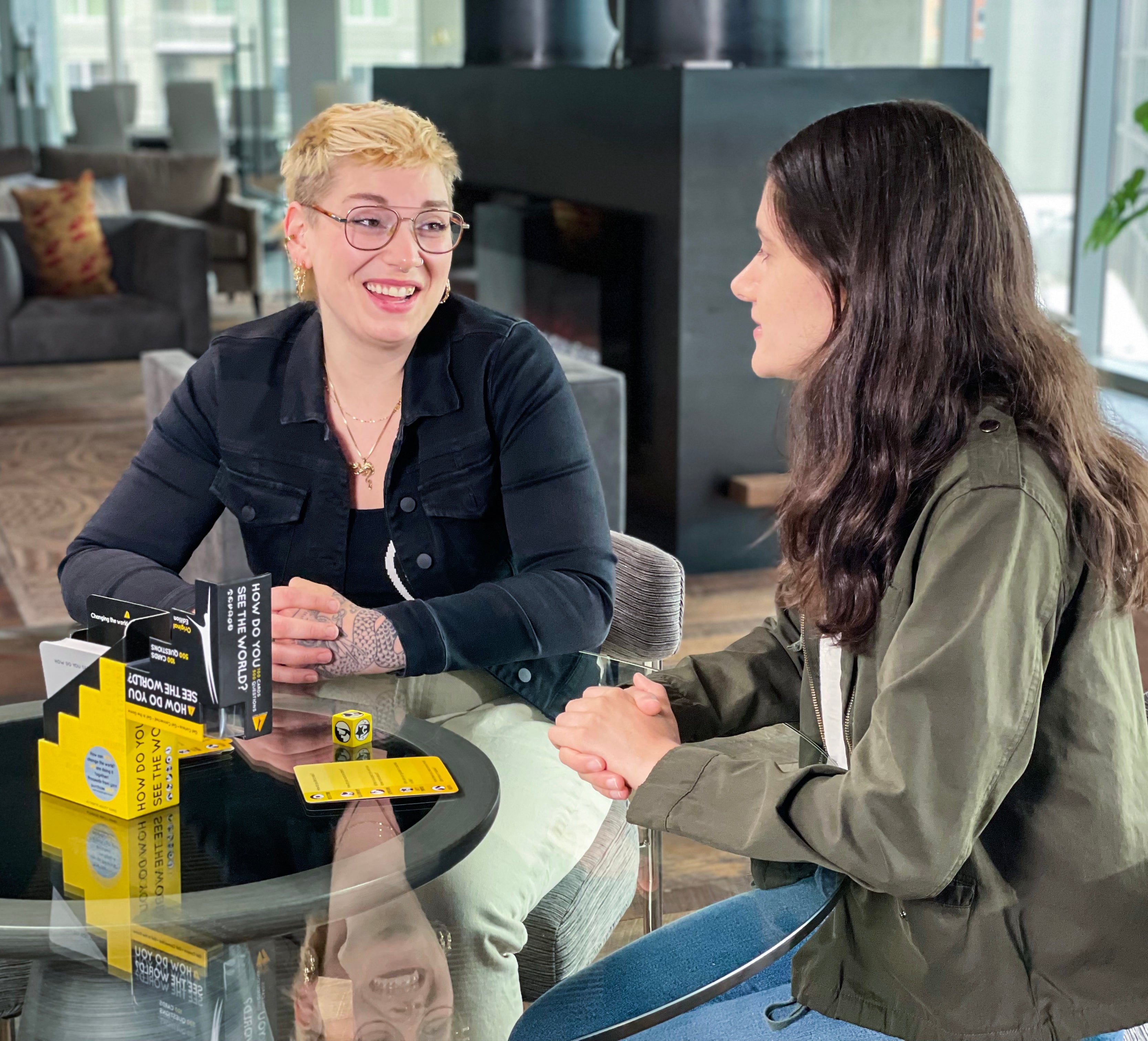 Two women connecting over our Signature card game, How Do You See the World. Authentic Agility Games